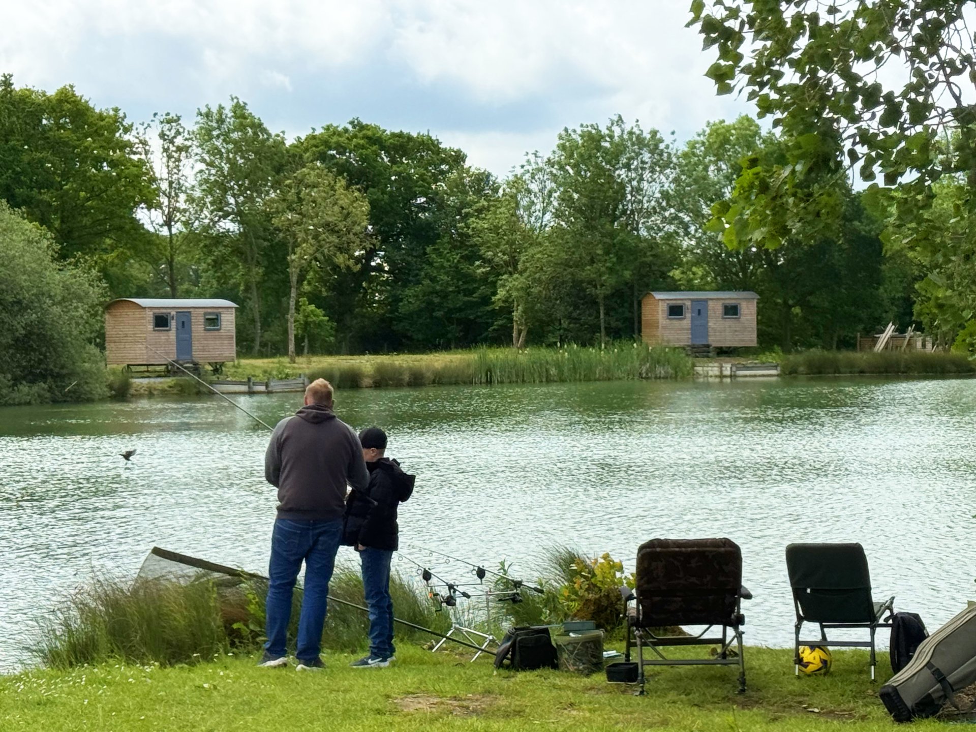 View across the lake towards two of our huts