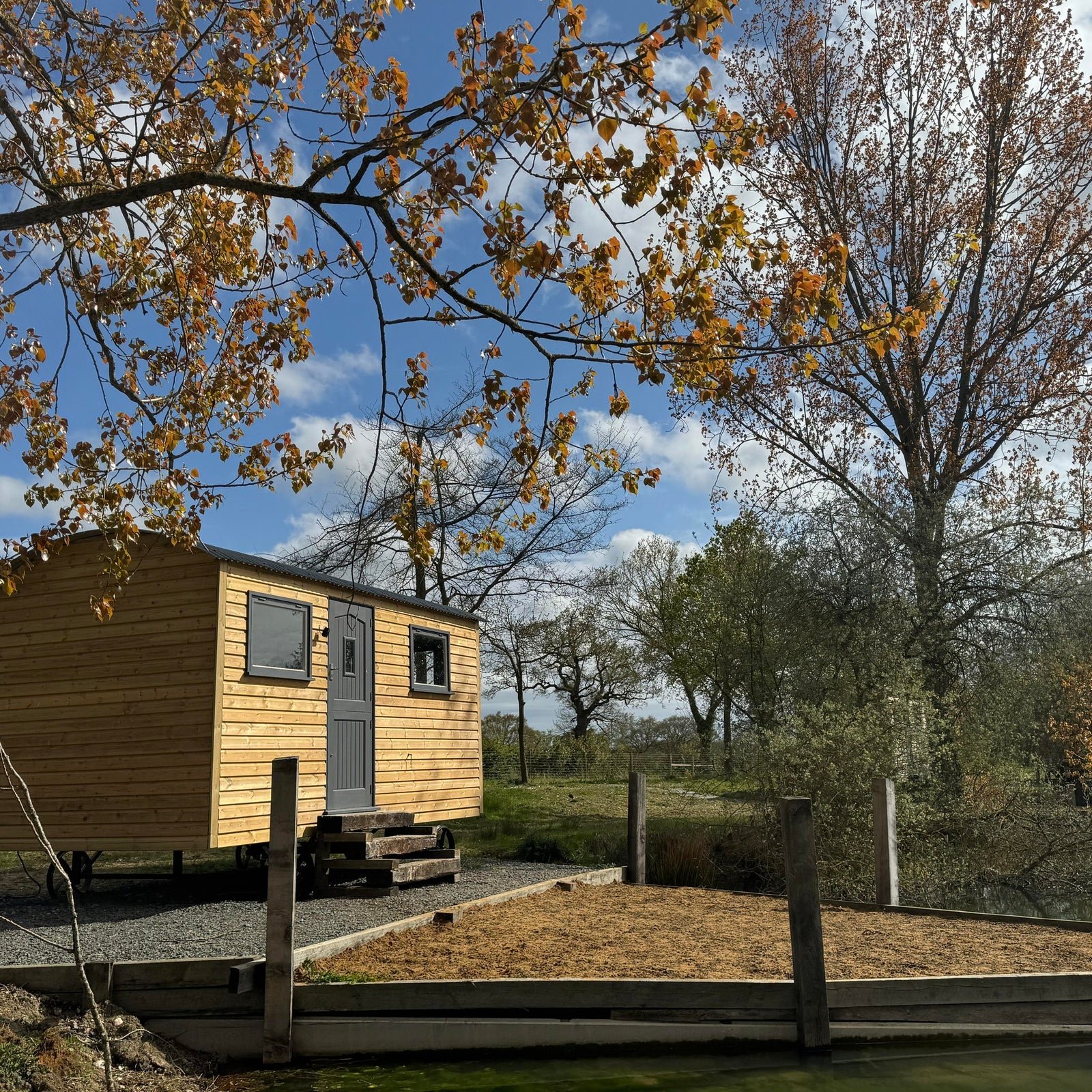 Exterior view of a shepherd hut at Lake Lodge Fisheries